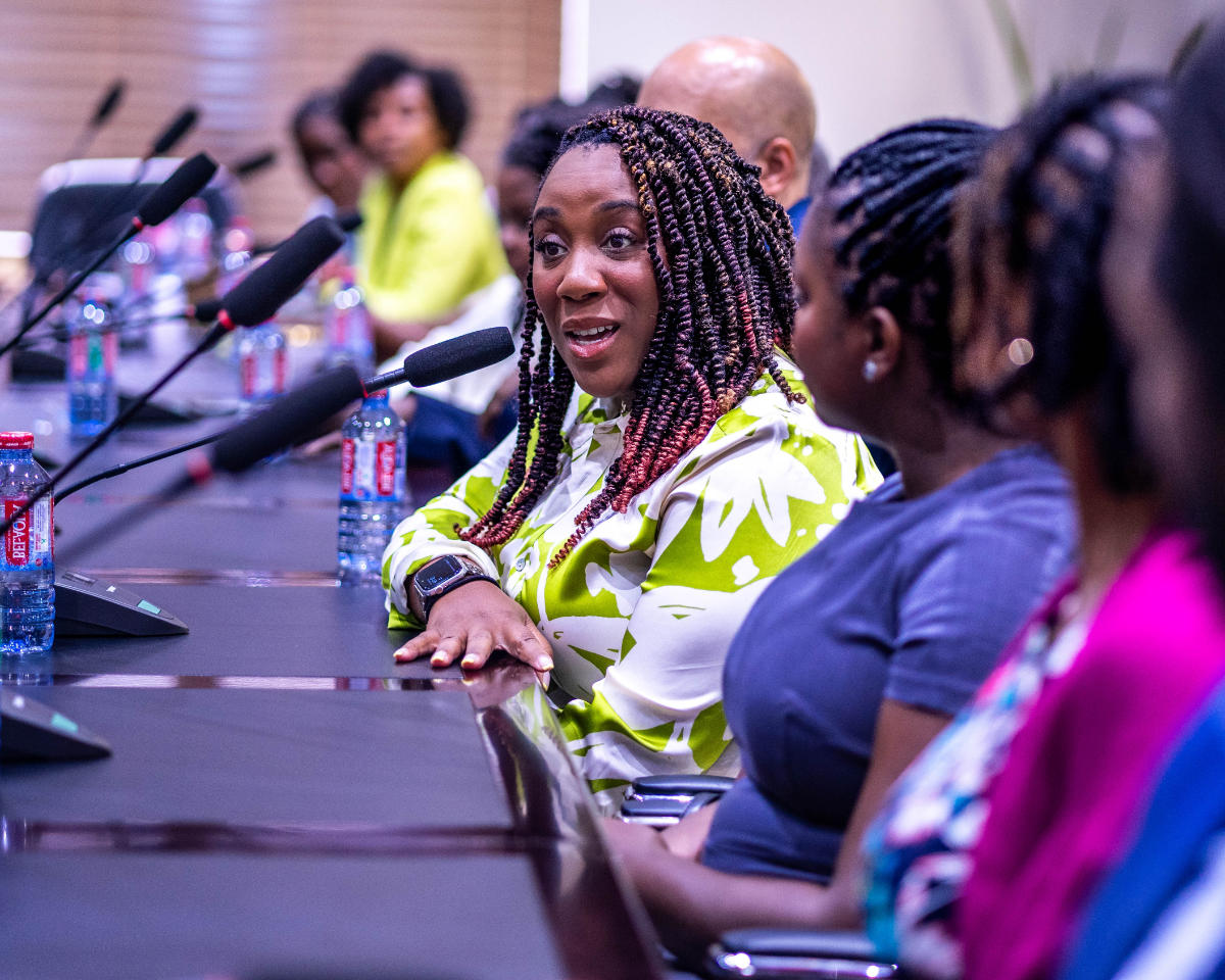 lady asking a question at a conference
